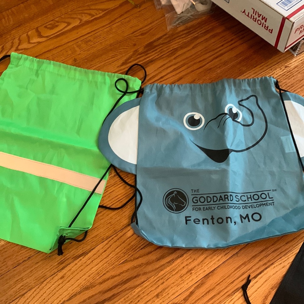 Free with purchase: set of 2 nylon material drawstring backpacks,good condition